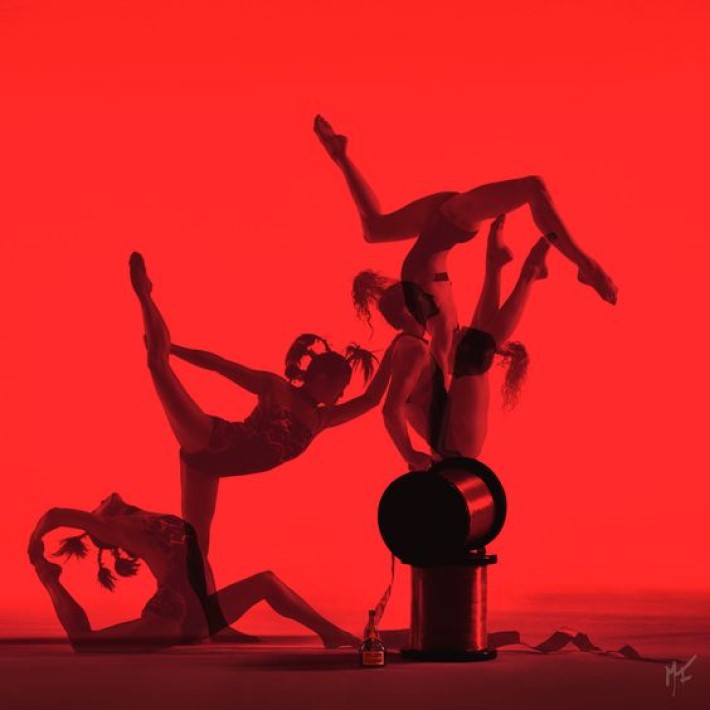 Visual storytelling photography by marco joe fazio of women ballerinas dancing with over-scaled thimbles of ribbon