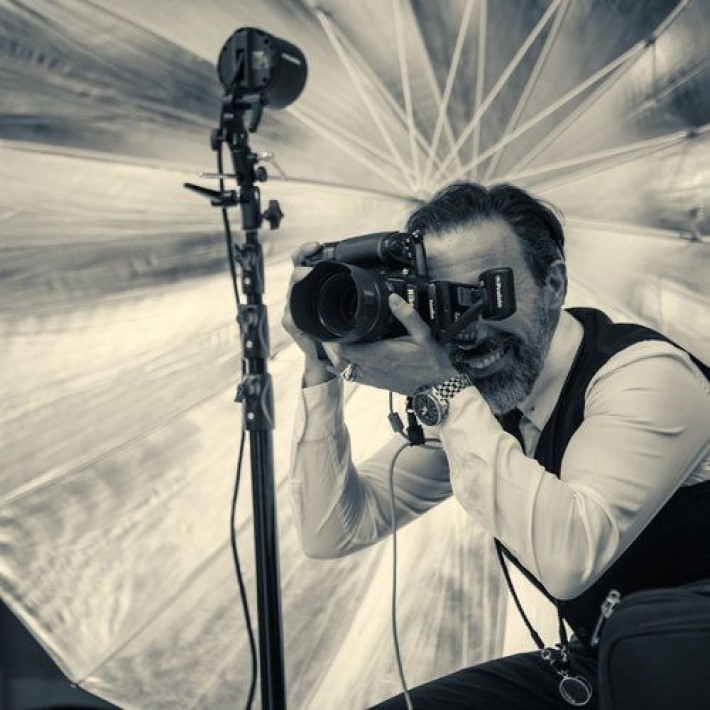 Marco Joe Fazio taking a photograph, a master of visual storytelling