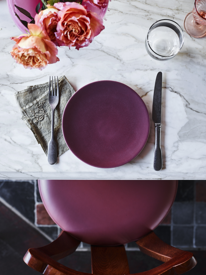 A table setting with purple dishes on a marble table at Pricillas restaurant at the Imperial Hotel Erskineville Sydney Australia - a LGBTQIA+ hotel