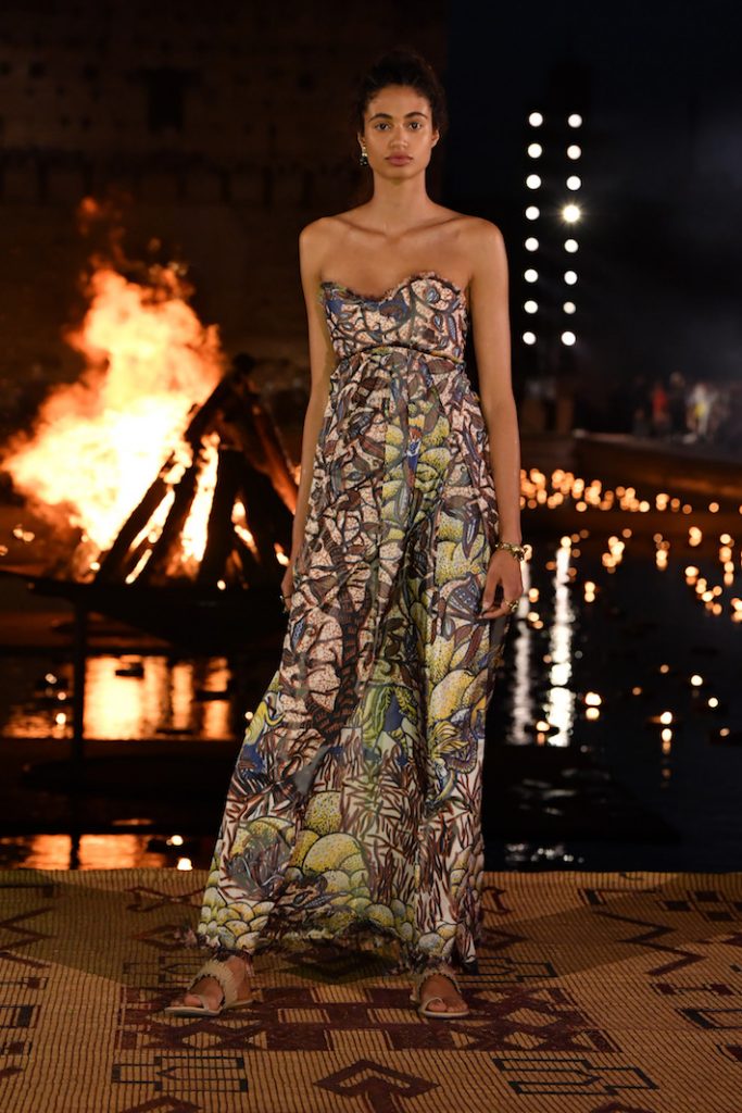 Model walks the runway during the Christian Dior Couture Cruise Collection wearing a printed maxi dress 