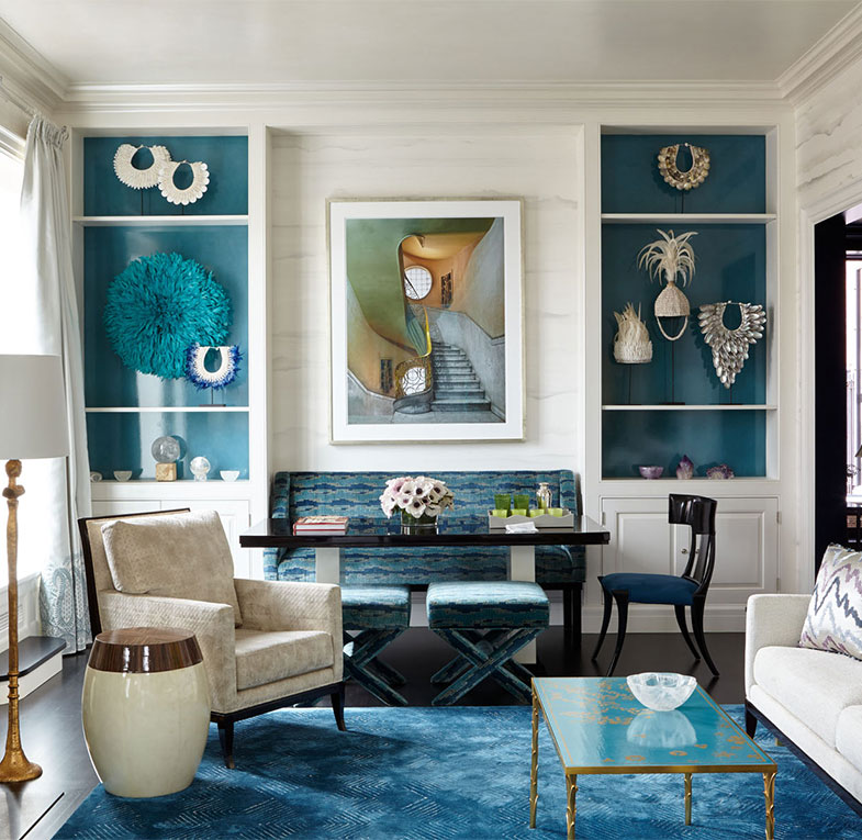 A luxurious blue and white living room in a New York penthouse