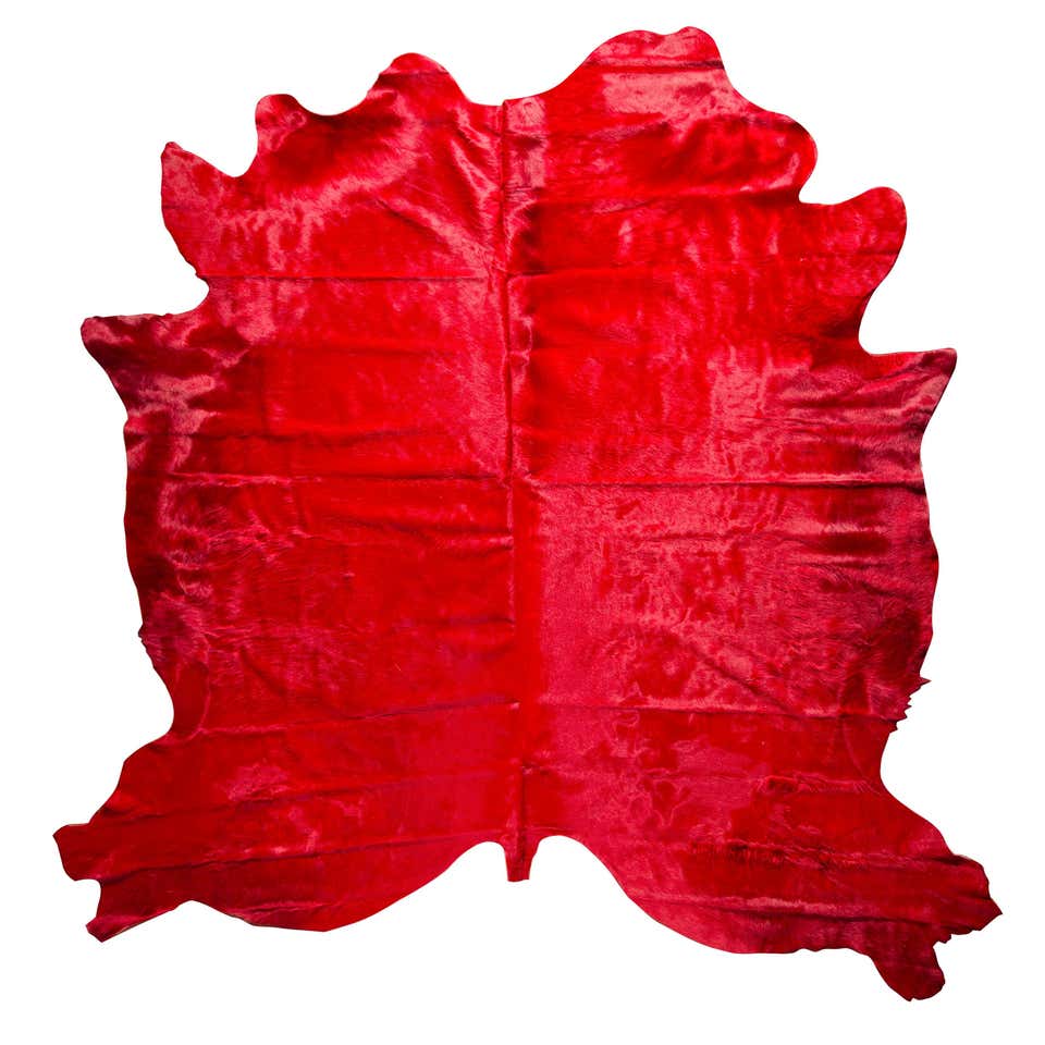 red cowhide rug