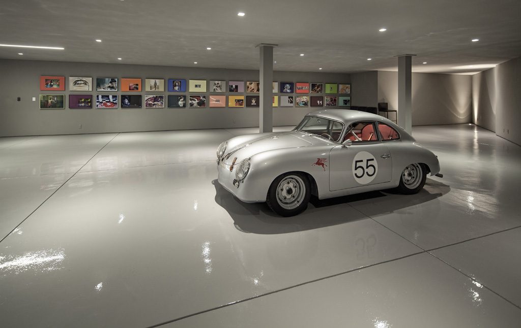 contemporary basement garage with a vintage car parked in it