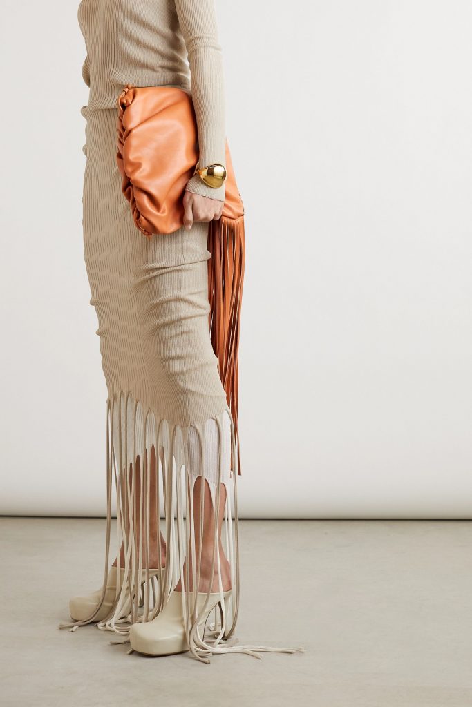 Fall 2020 Fashion Trends - BOTTEGA VENETA Open-back layered fringed ribbed-knit turtleneck dress with fringe shoulder bag