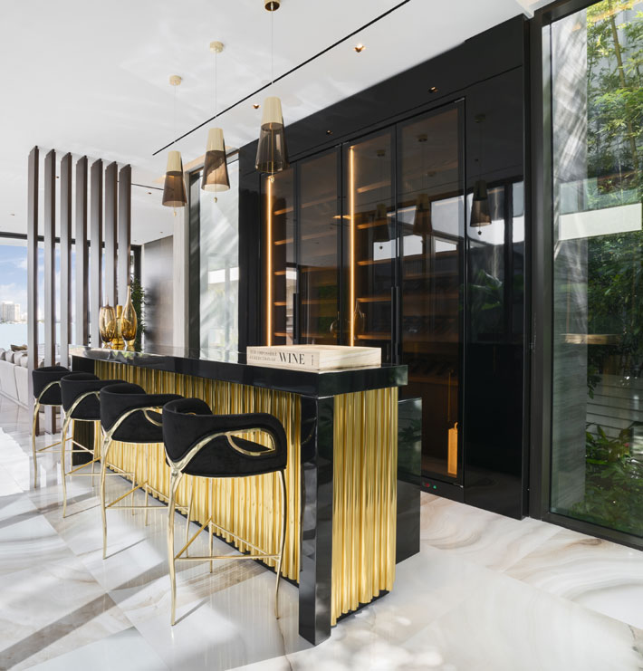 glamorous kitchen Interior design by Mendez Vela featuring Chandra Bar Stools by KOKET