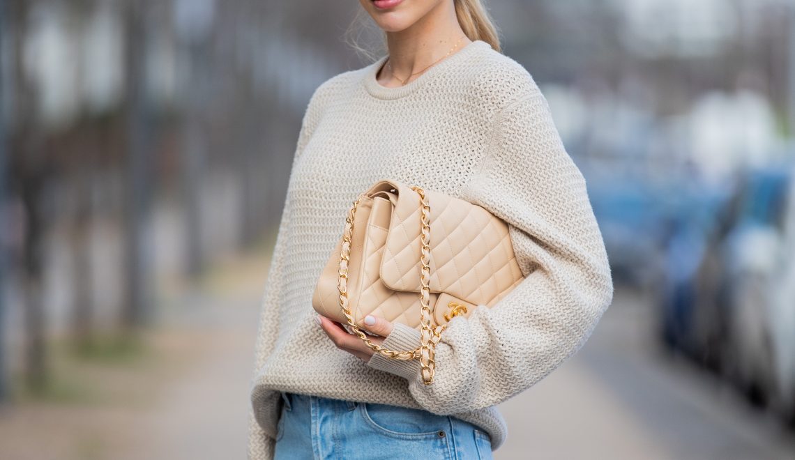 fashion style rules french women follow Ann-Kathrin Götze wearing beige Ferragamo jumper, denim jeans Saint Laurent, Chanel bag in beige, Dior sunglasses Dior (Photo by Christian Vierig/Getty Images)