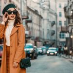 wardrobe style tips dressing for confidence Outdoor autumn portrait of young elegant fashionable woman wearing trendy sunglasses, camel color coat, turtleneck, with textured leather shoulder bag, walking in street of European city