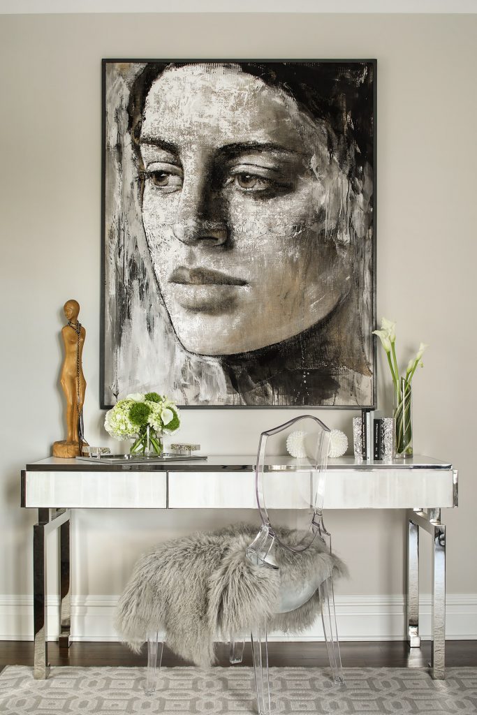 Interior design by Karen B Wolf with an acrylic plexiglass chair at a vanity table