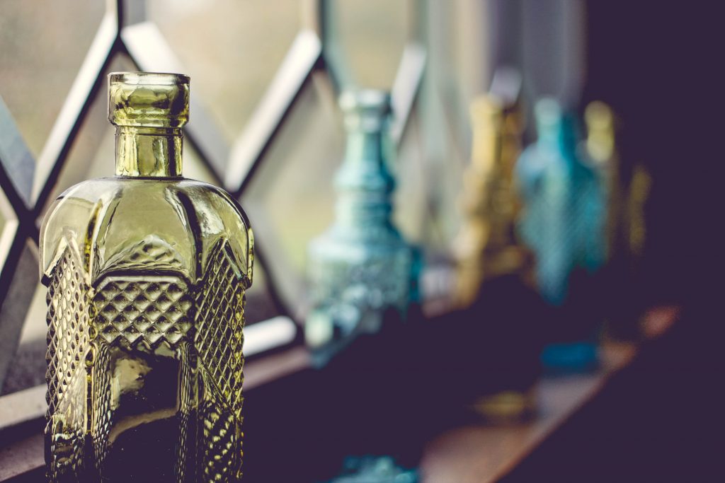 how to decorate your window sills with style using glass bottles accessories