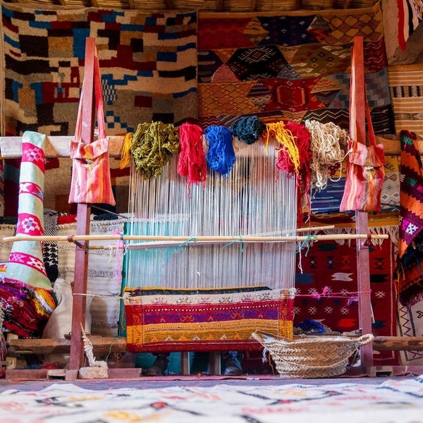 colorful moroccan rugs being woven from the finest wool zarabe