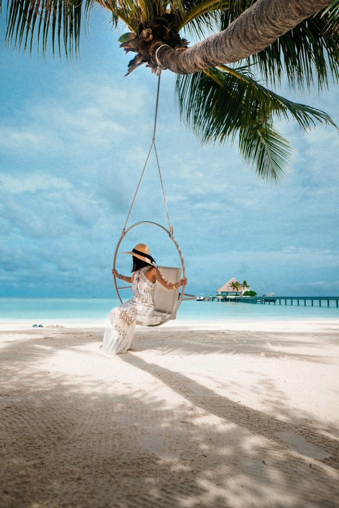 woman on the beach luxury holiday destinations maldives