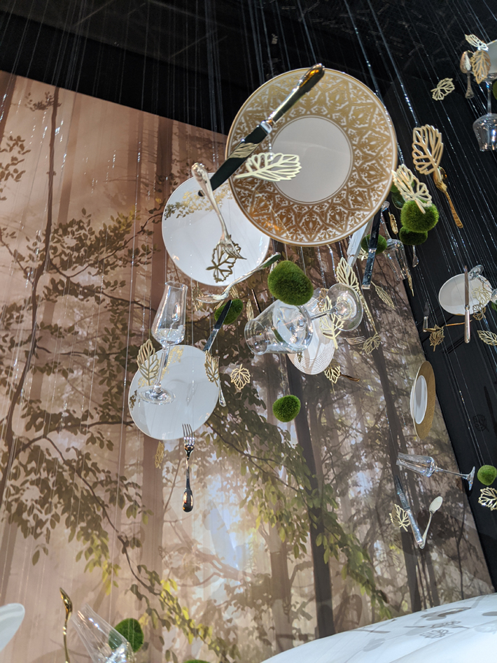 The Tanagra exhibit in the France Pavilion showcasing luxury table settings. #Tanagrareimagined