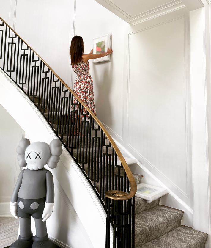 Gabé Hirschowitz curating a gallery wall for KAWS - galerie perrie - online art gallery