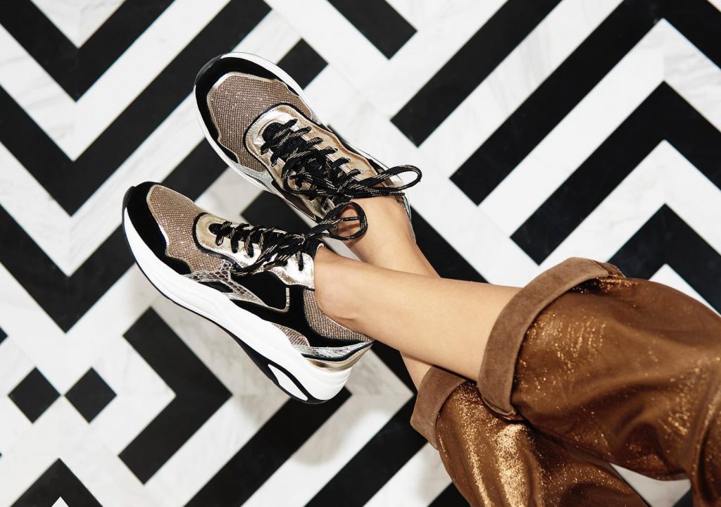gold and black sneakers by san marina shoes