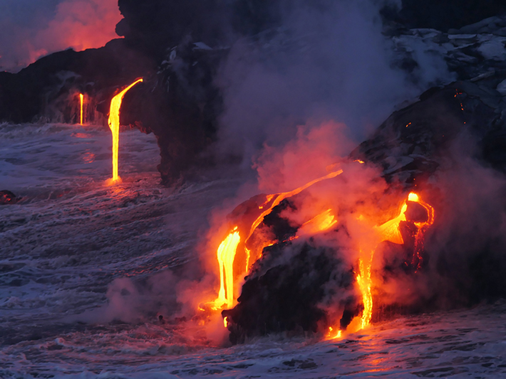 Lava from Kilauea Volcano on Hawaii flows into the ocean (Photo by Marc Szeglat / Unsplash)