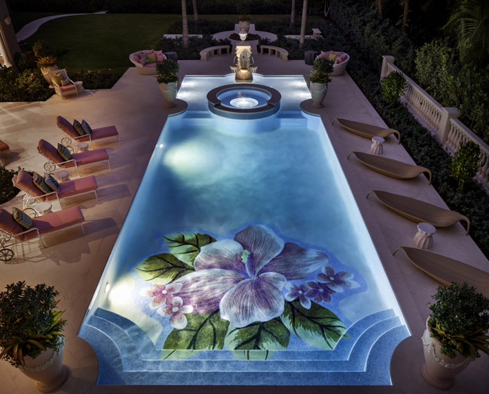 luxury pool design by lori morris with floral tile pattern