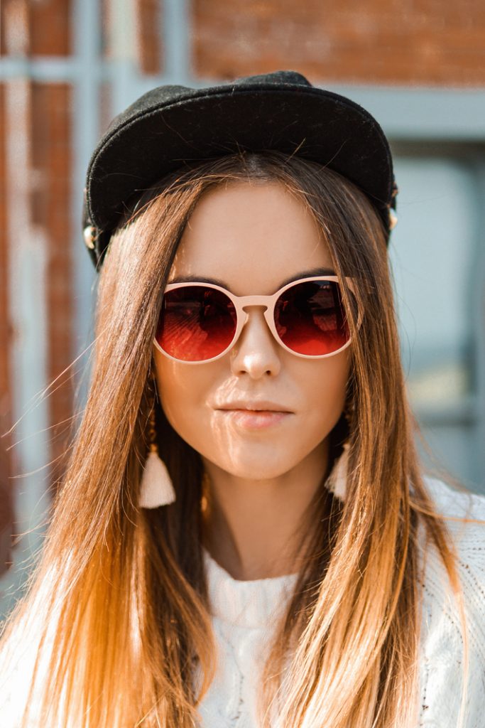 styling a cap tips with sunglasses