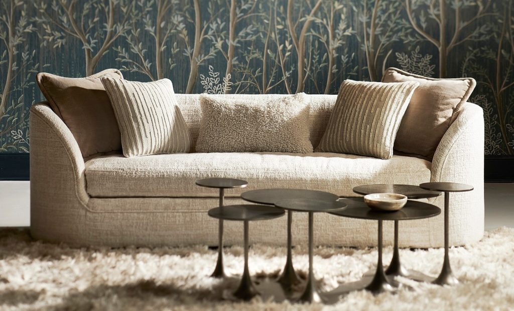 Bernhardt Interiors Amara sofa and circlet cocktail table, shown against a backdrop of gorgeous wallpaper by Schumacher
