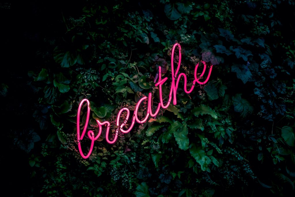 Image of a breathe sign embracing mental health