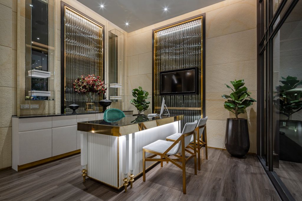 Bright office room with gold and white by Double V Space