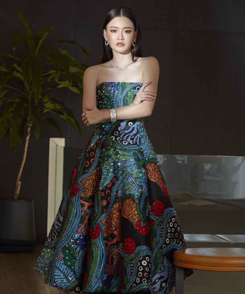 Jules Soontornvinate in colorful dress in partial shadow thai interior designer