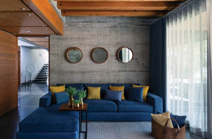 blue and gold modern family room Interior by Mariangel Coghlan
