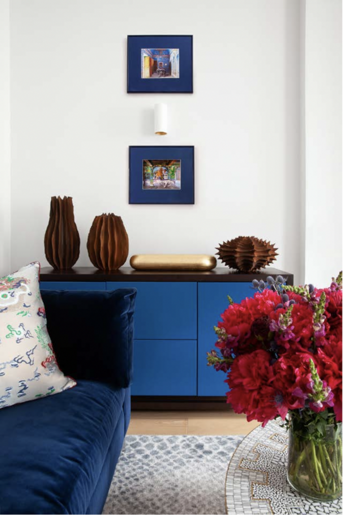 Marc Ricourt sculptures on blue credenza