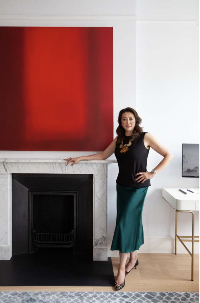 Jasmine Lam with red Louise Crandell painting and fireplace