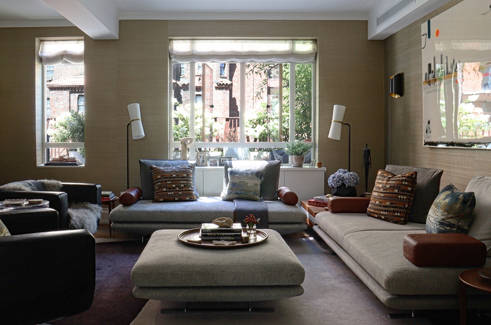 low profile furniture and glossy finishes light color tone for maximized small space