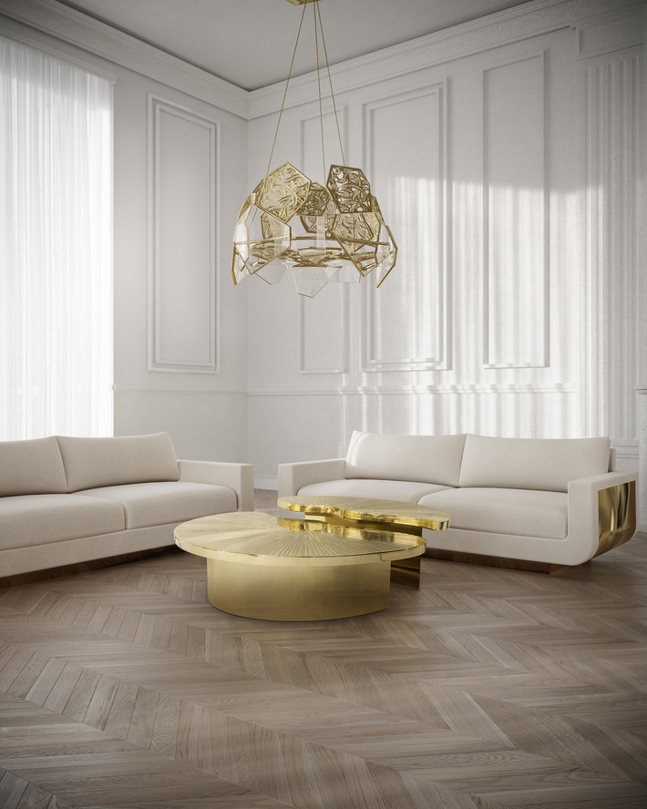 koket hypnotic chandelier glass and gold with sofia sofa in white and gold myth cocktail table polished brass two piece round natural inspired coffee table