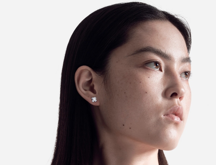 Woman wearing pearl studs