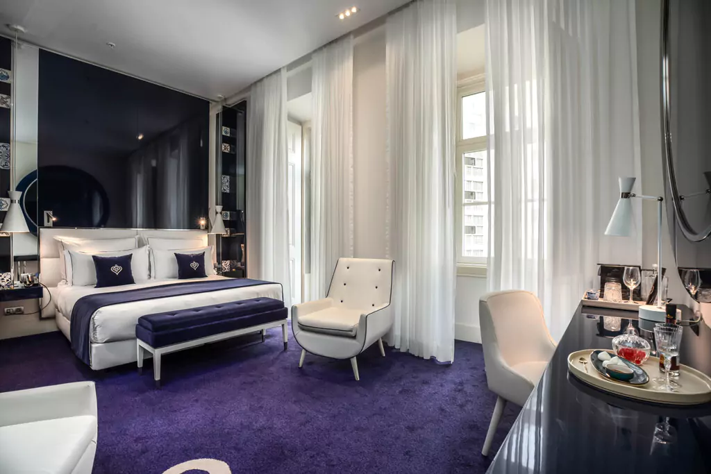 hotel portugal boutique hotels lisbon phc bedroom suite luxury interior purple carpet white furniture