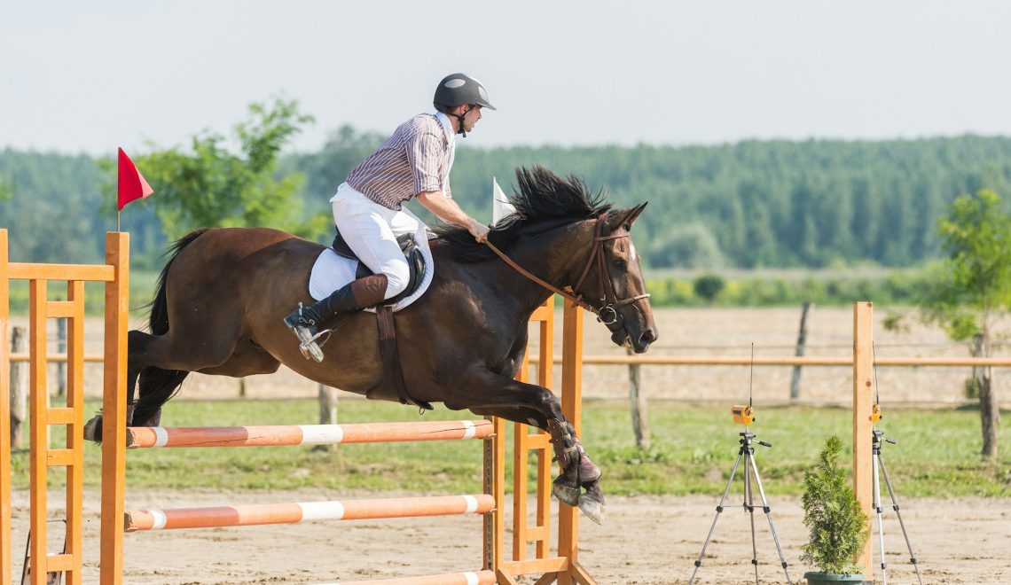 young man riding a horse