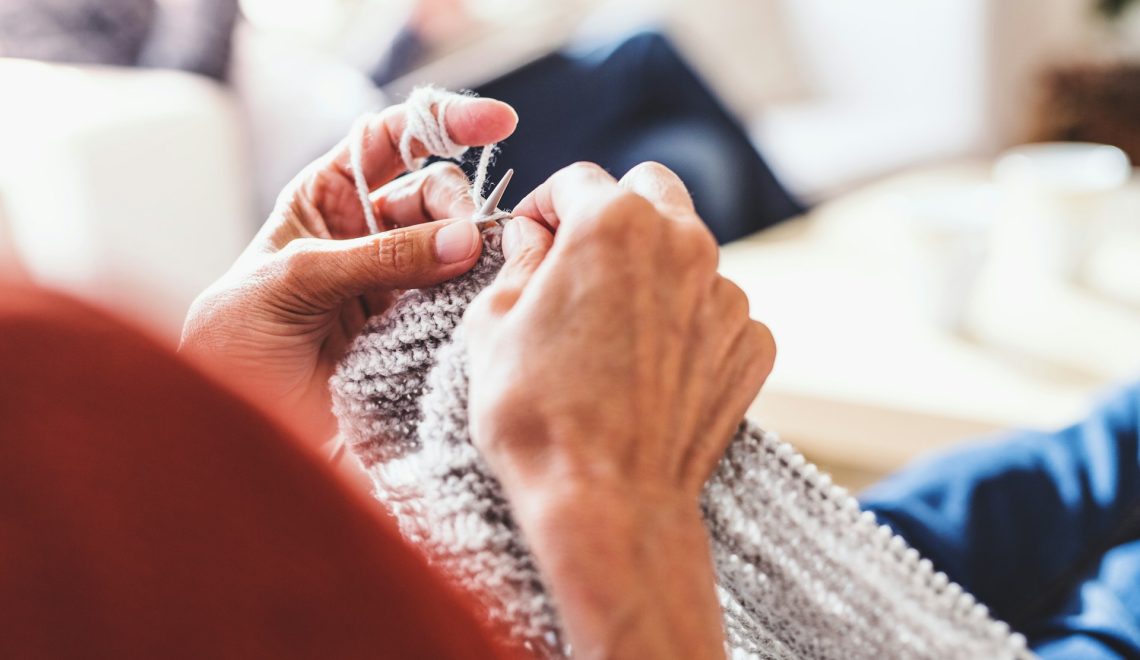 senior woman knitting