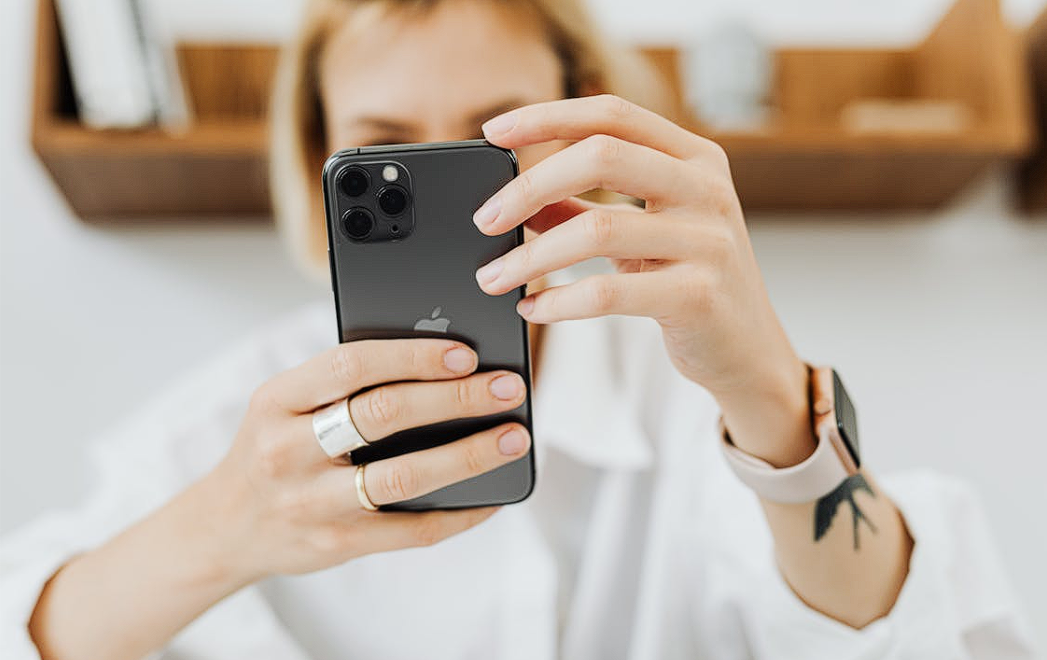 Woman holding an iphone