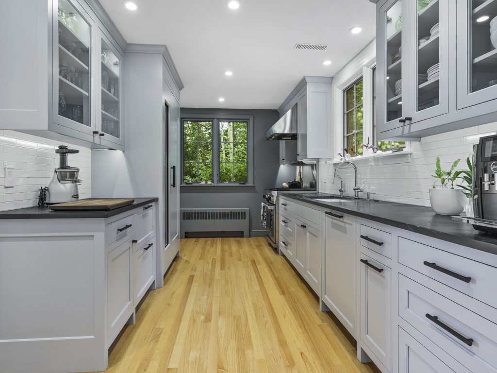 Gray and black kitchen with view of the outdoors Sustainable Interiors