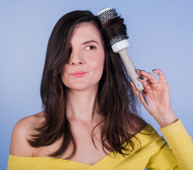 Woman using a hot brush