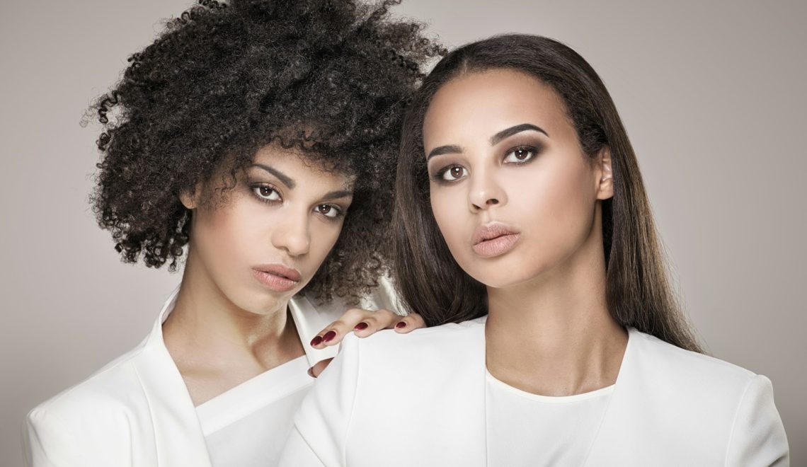 elegant women posing together