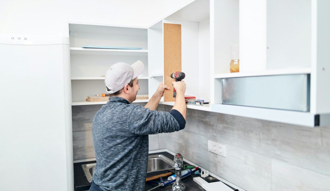 man assembling furniture
