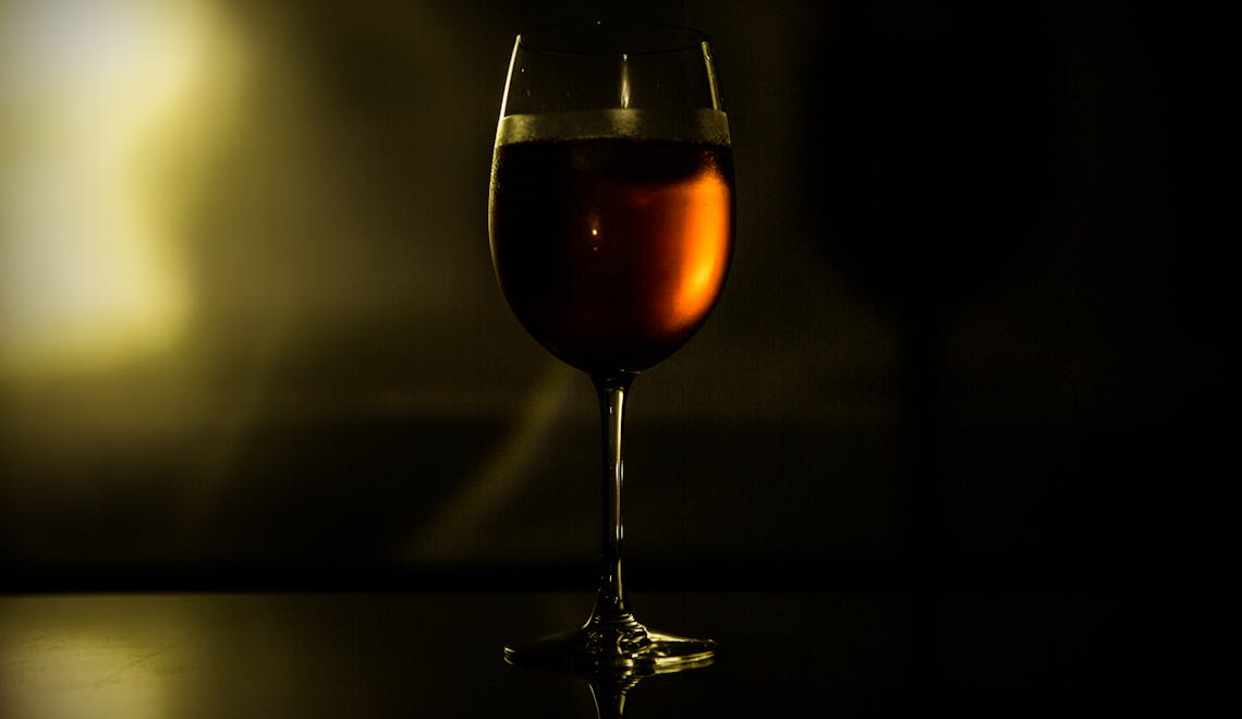 clear wine glass with red wine