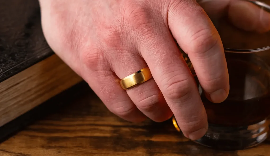 a man's hand with a ring
