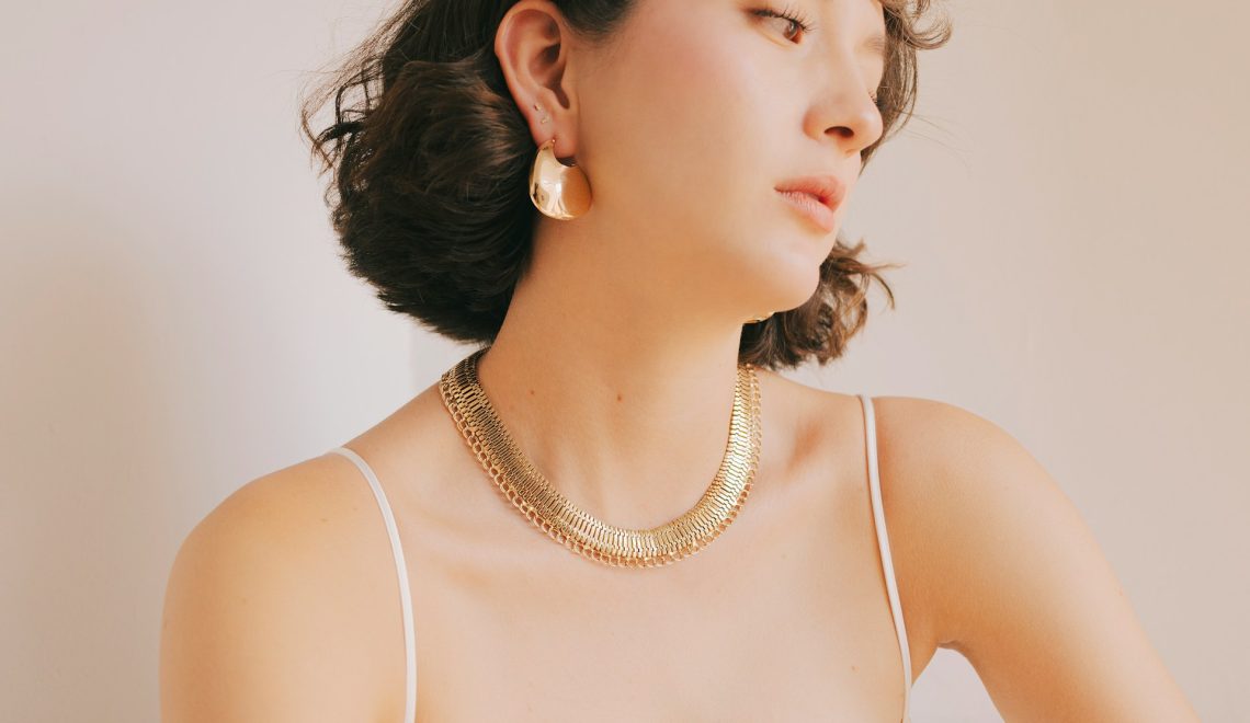 woman wearing gold accessories