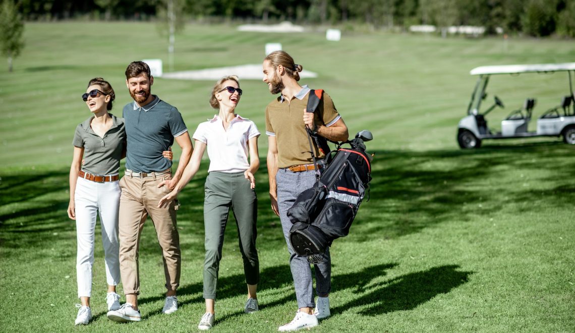 friends hanging out on a golf course