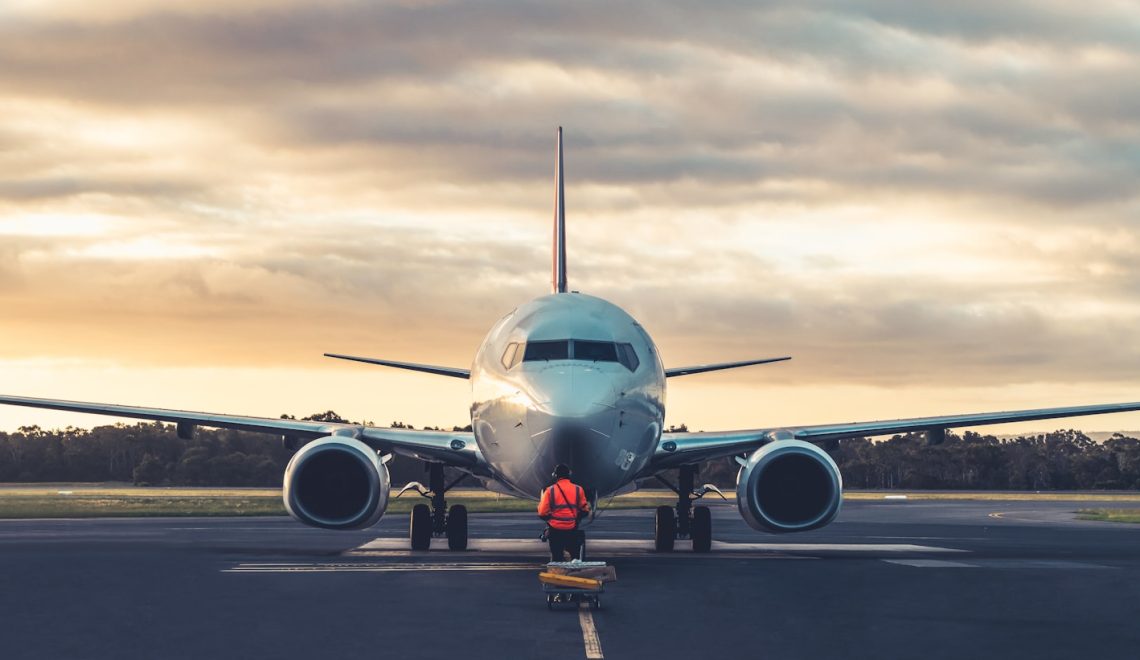 sunset view of airplane on airport runway