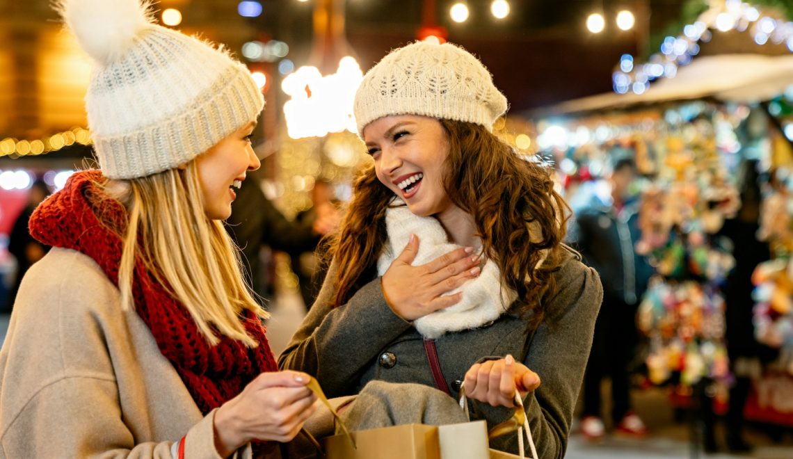 Two women shopping in a christmas market
