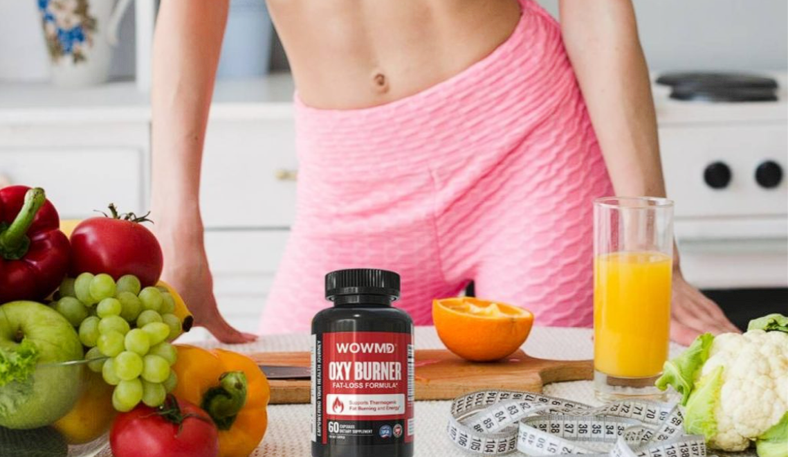 Weight-loss supplement displayed on a kitchen counter with fruits, juice, and a fit woman in the background