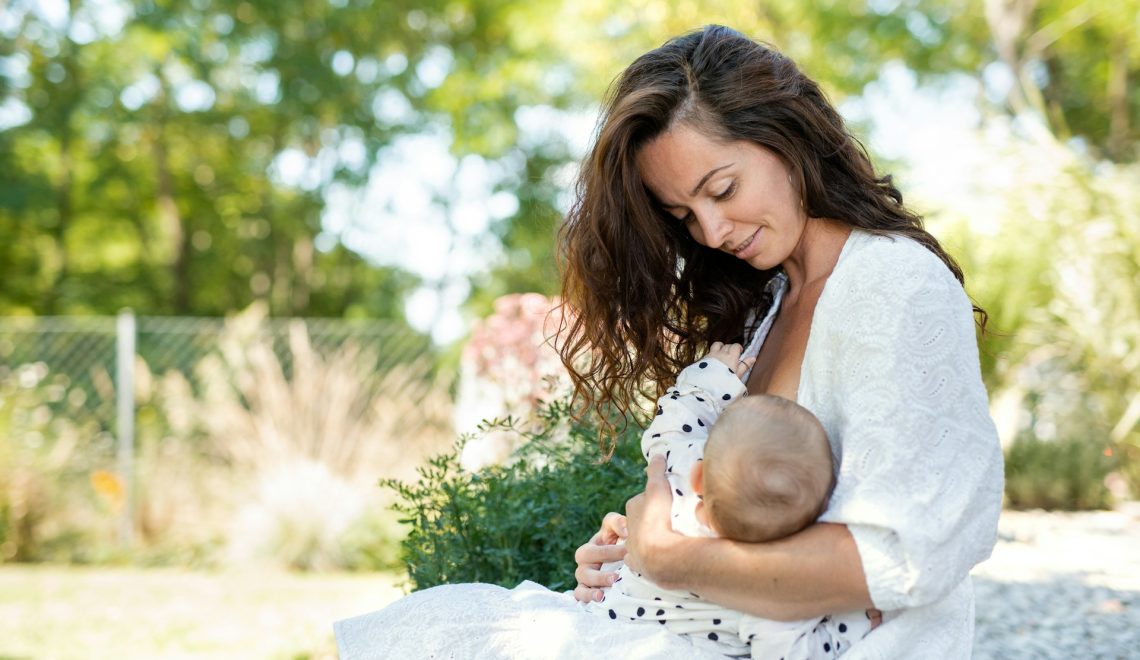 woman breastfeeding a baby