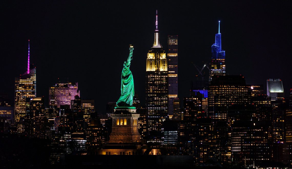 Statue of Liberty standing out along the New York city skyline