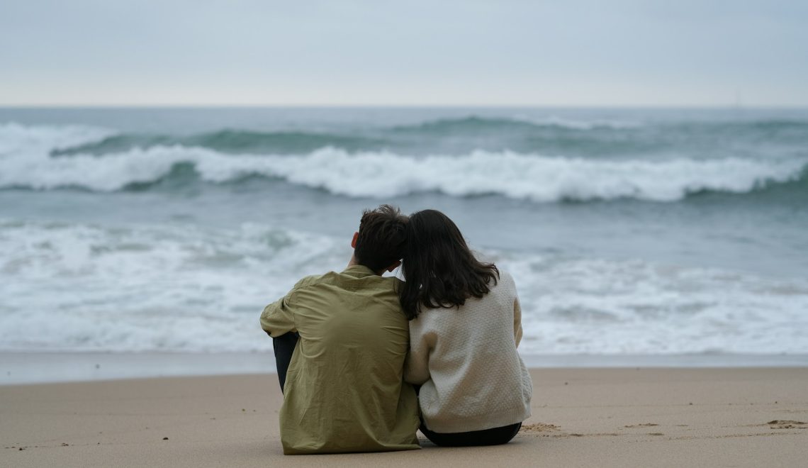 A couple sitting on the beach