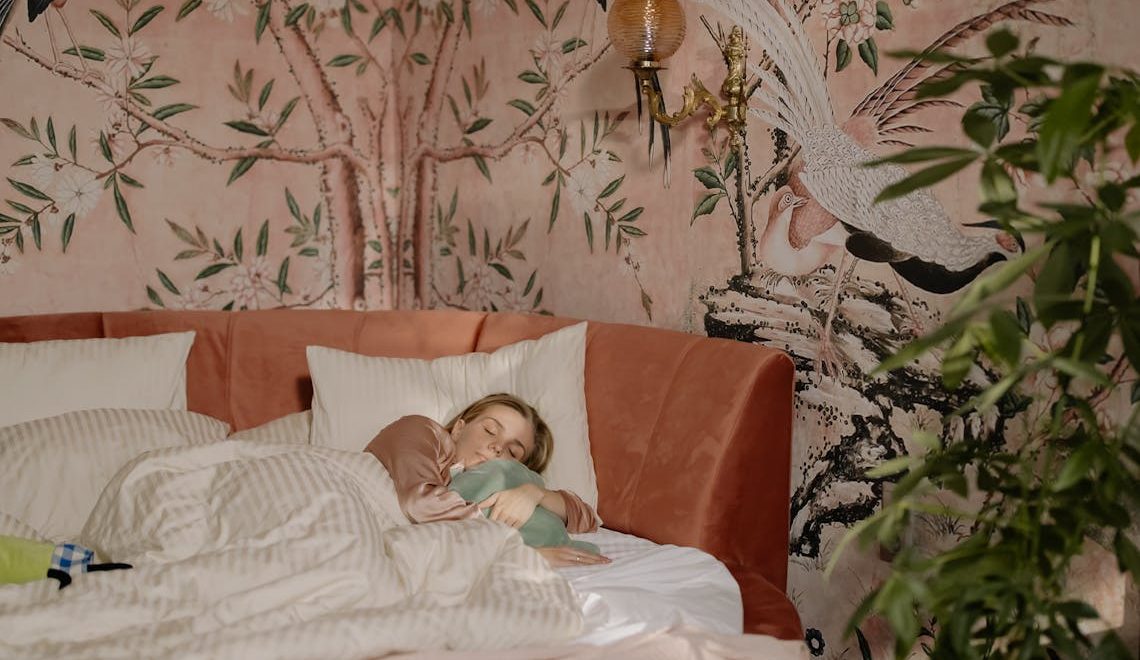 Woman sleeping and hugging a pillow
